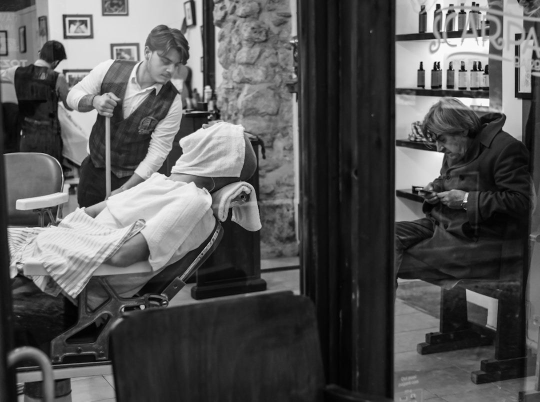 Professional barbershop interior in Queens NYC offering low fade haircut services with transparent pricing and expert barbers