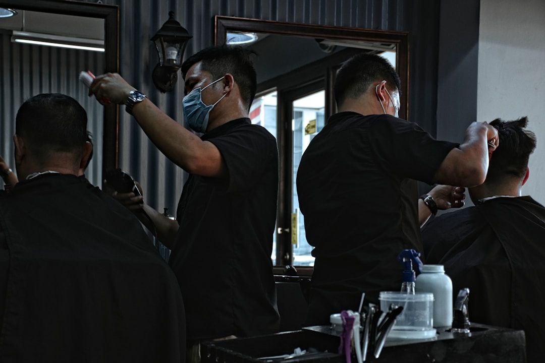 Professional barber performing premium quality fade