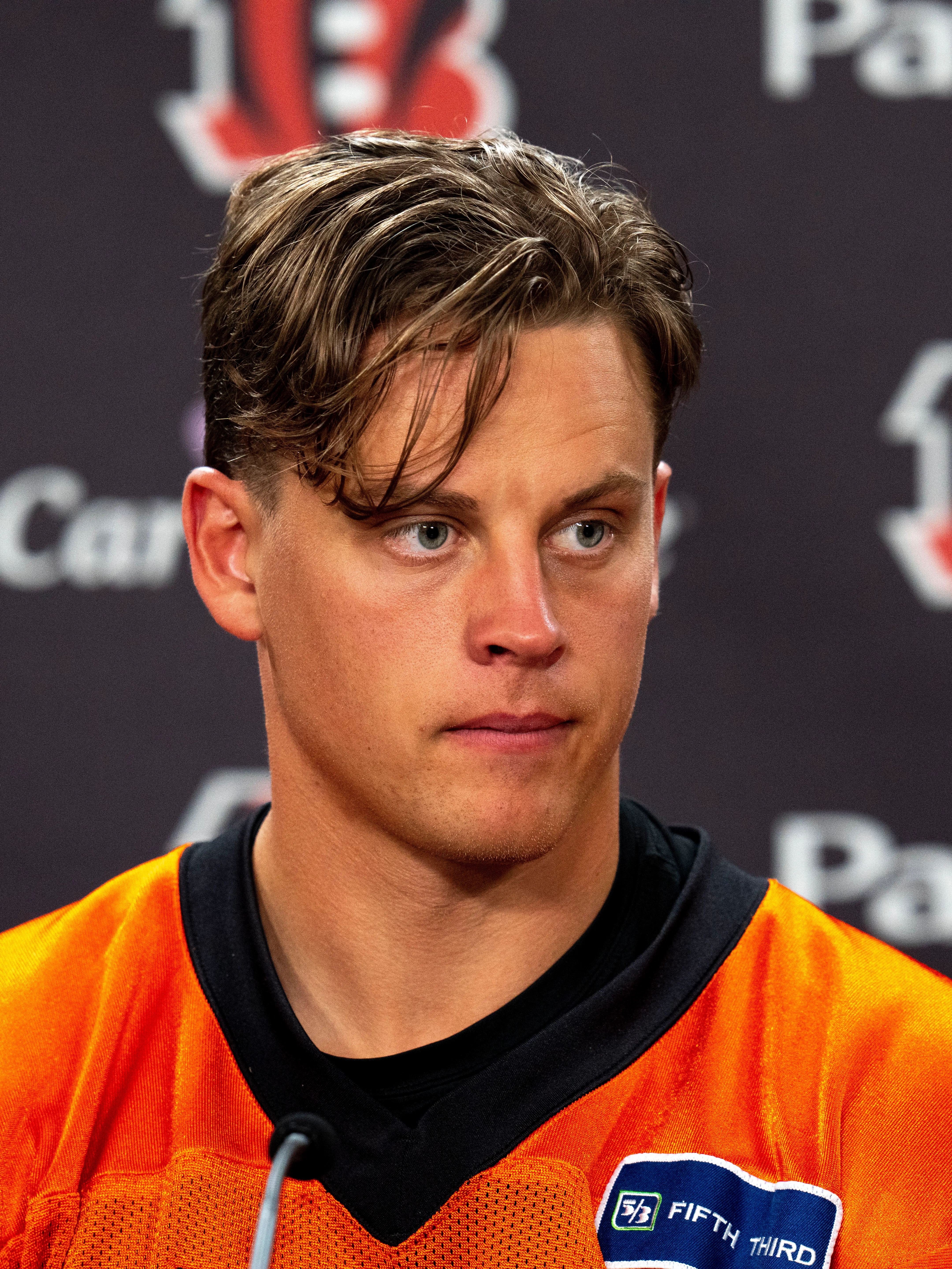 Joe Burrow comb over fade haircut 2026 professional quarterback hairstyle high contrast polished styling Queens NYC