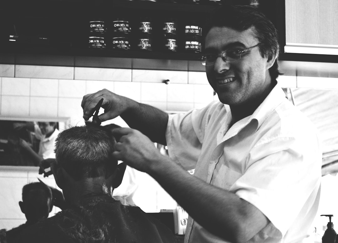 Professional barber providing expert low fade haircut maintenance