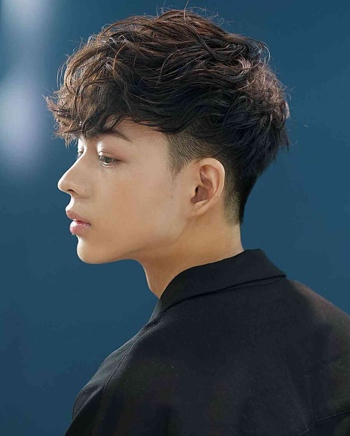 Messy fringe hairstyle with textured layered bangs showing effortlessly cool styling technique