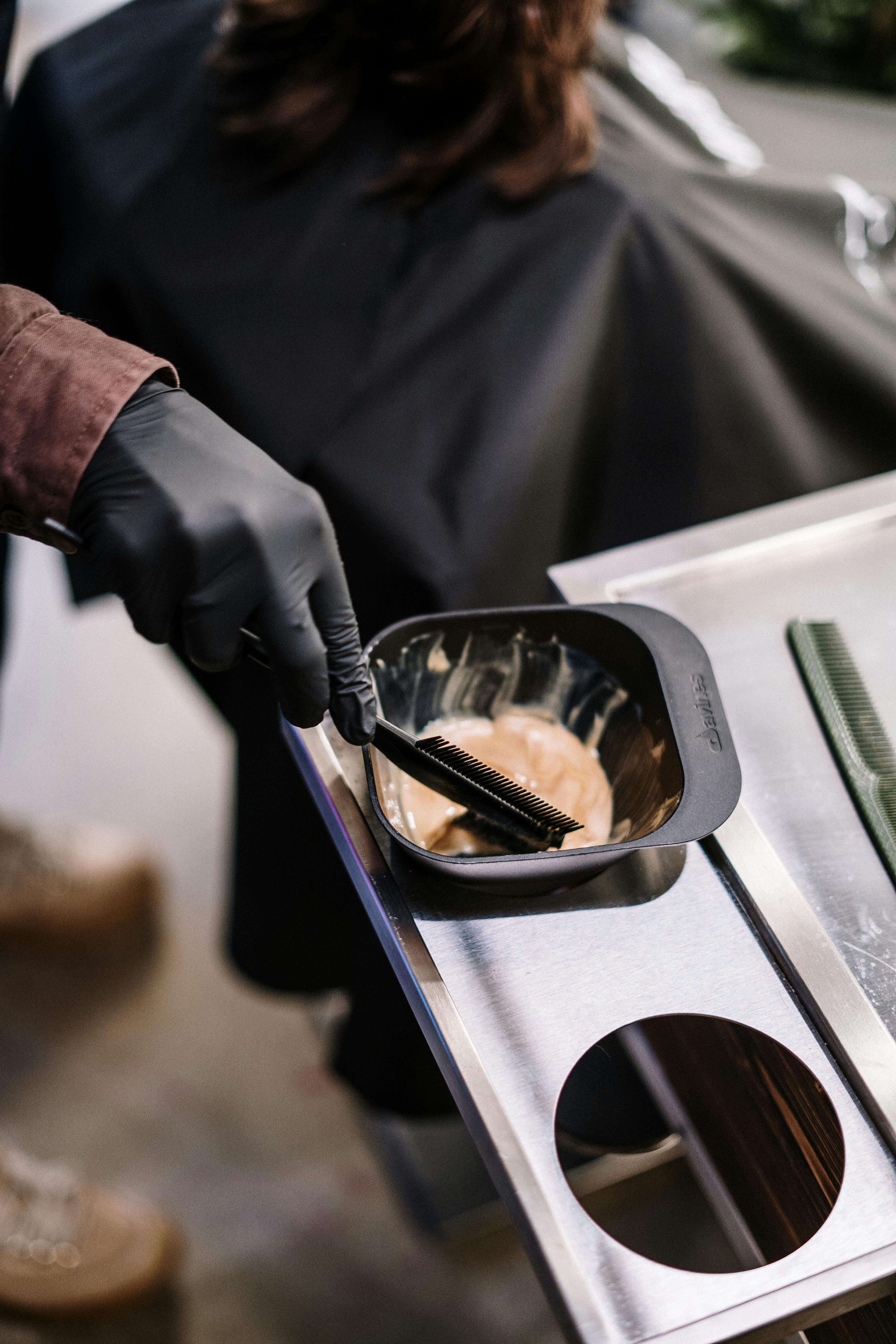 Professional hair color mixing and preparation at DIDA Hair Studio