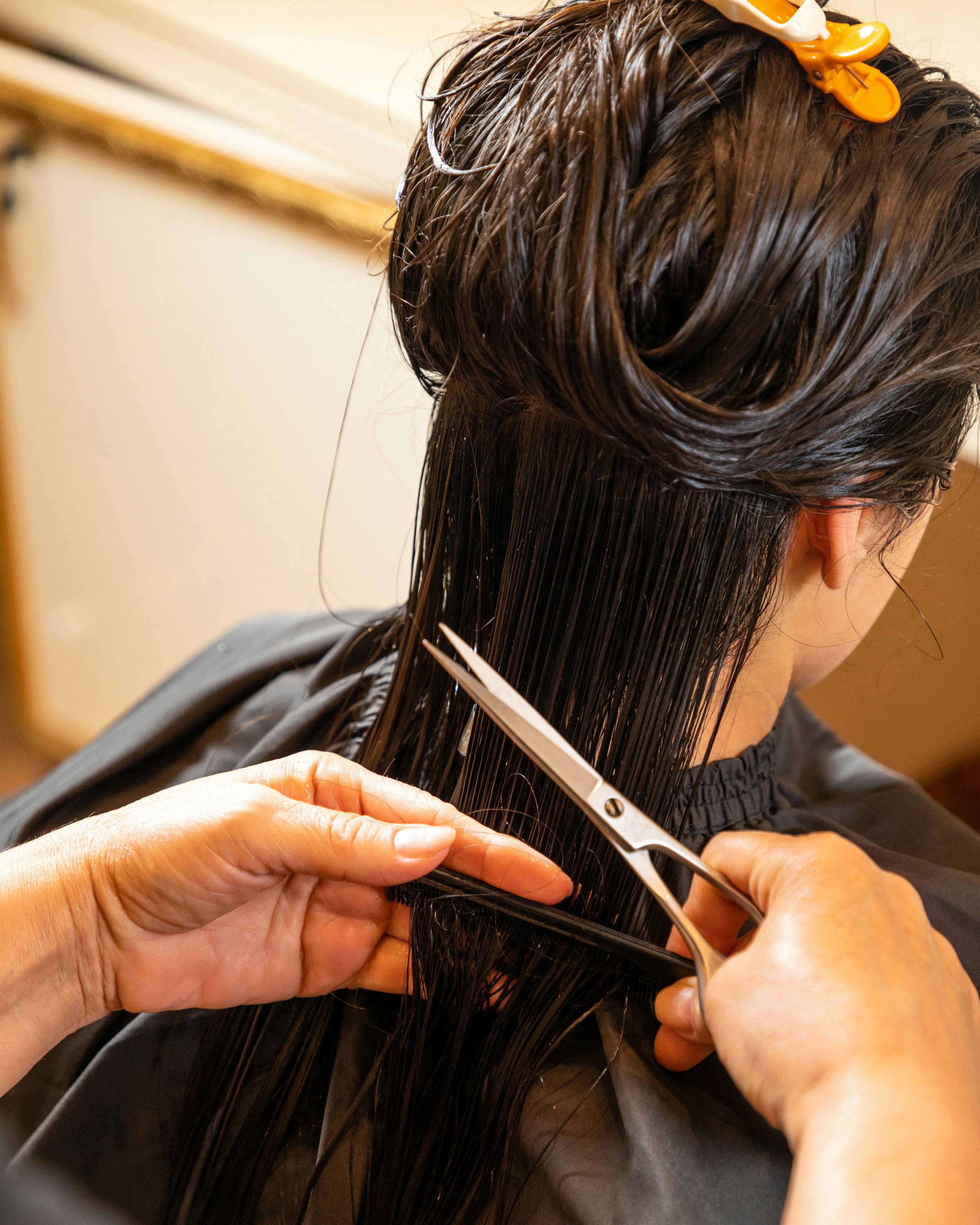 Professional long hair cutting technique at DIDA Hair Studio